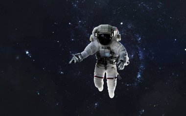 Uzay yürüyüşünde astronot, EVA, uzayın derinliklerinde galaksi. Bu görüntünün elementleri NASA tarafından desteklenmektedir