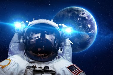 Astronaut in outer space against the backdrop of the planet clipart