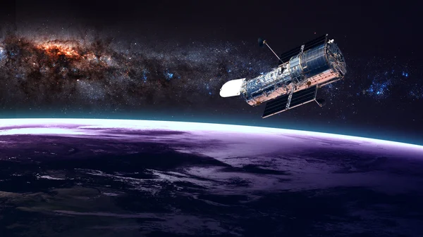 The Hubble Space Telescope in orbit above the Earth. Elements of this image furnished by NASA. — Stock Photo, Image