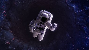 An astronaut floats above billions of stars. Stars provide the background. Elements of this Image Furnished by NASA.