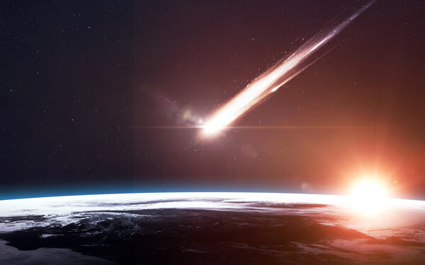 A Meteor glowing as it enters the Earths atmosphere. Elements of this image furnished by NASA