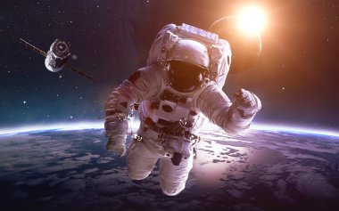 Dünya gezegeni üzerinde uzayda astronot. Nasa tarafından döşenmiş bu görüntü unsurları