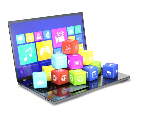 Laptop och kuber med ikoner på tangentbordet. — Stockfoto