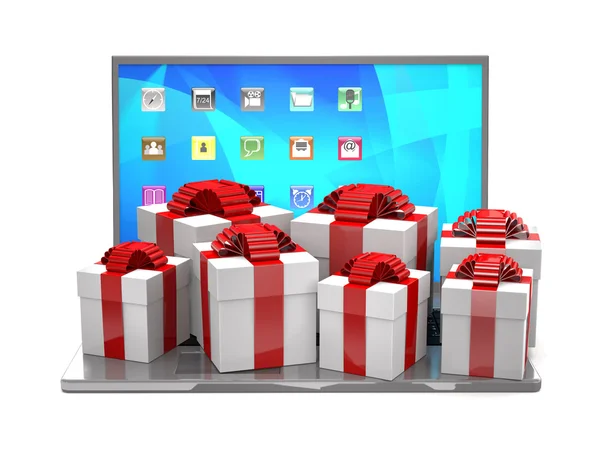 Cajas de regalo en un teclado portátil . — Foto de Stock