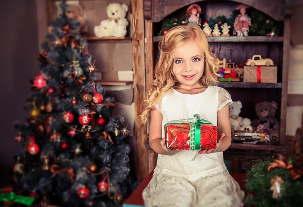 Little girl with Christmas present Stock Image