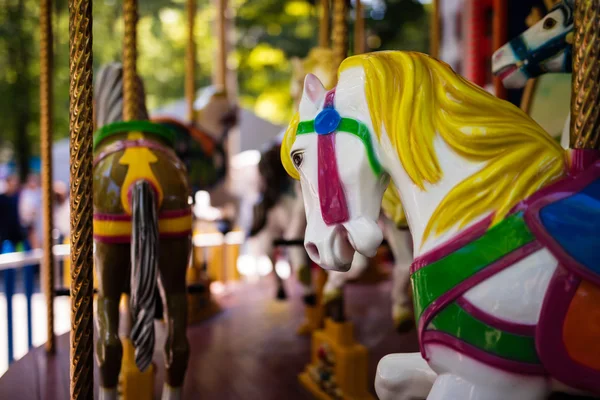 Carousel with Horses on a carnival Merry Go Round — Stock Photo, Image