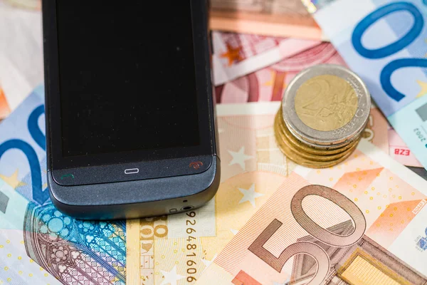 Telefon und Geld — Stockfoto