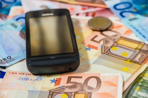 Telefon und Geld — Stockfoto