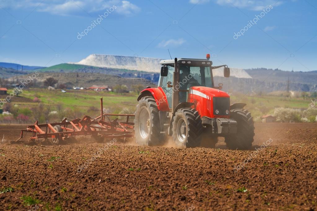 Brand New Red Tractor Plowing The Land Stock Photo Image By C Jordan Rusev 54232777