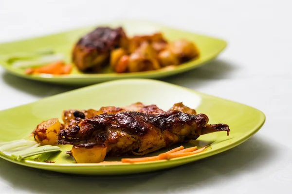 Roasted rabbit leg and vegetables — Stock Photo, Image