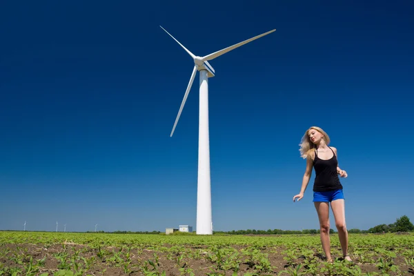 Female at wind power generator — Stock Photo, Image