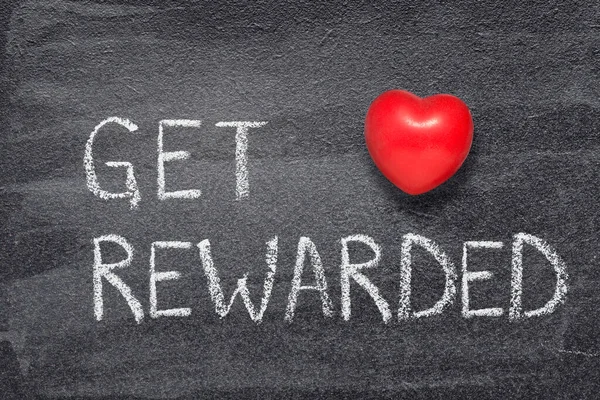 get rewarded phrase written on chalkboard with red heart symbol