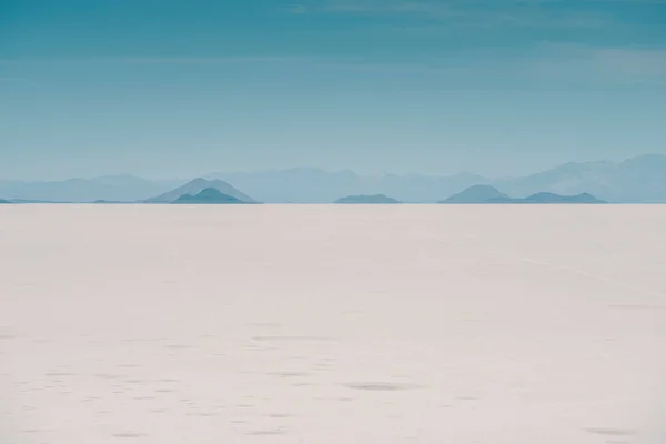 endless Uyuni Salt Flats landscape by sunny day in Bolivia