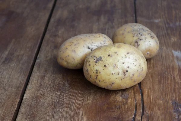 Three potatoes — Stock Photo, Image