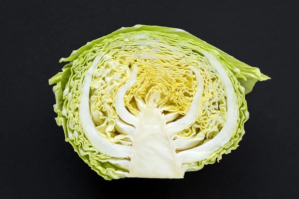 Half cabbage on black — Stock Photo, Image