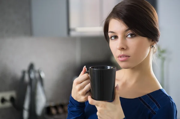 Morning housewife with cup of coffee — Stock Photo, Image