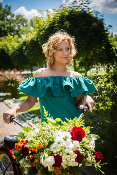 Woman with bicycle — Stock Photo, Image