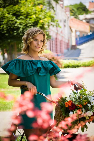 Woman with bicycle — Stock Photo, Image