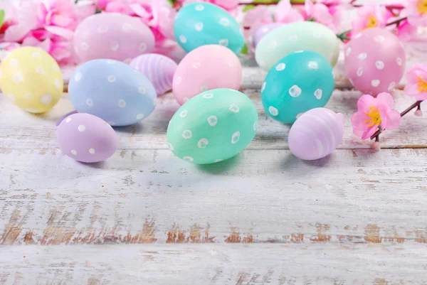 Easter eggs on old wooden background with space for text — Stock Photo, Image