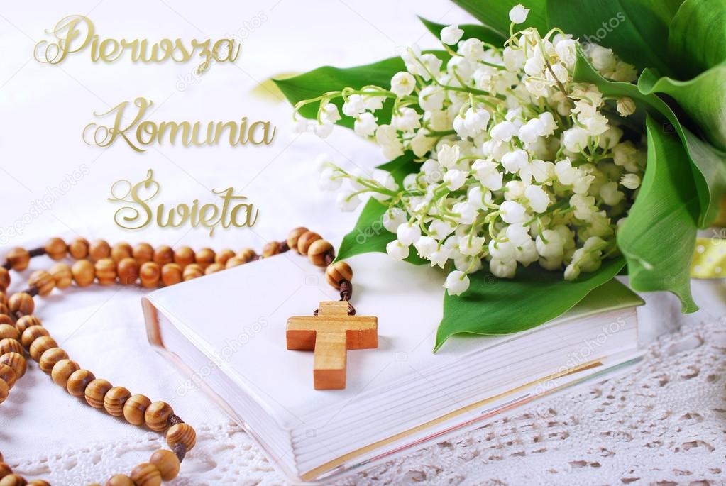 The first holy communion in polish with rosary and flowers Stock Photo