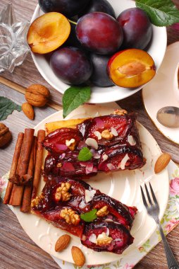 piece of plum cake with nuts and spices clipart