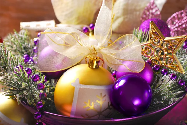 Christmas decoration in purple and golden colors — Stock Photo, Image