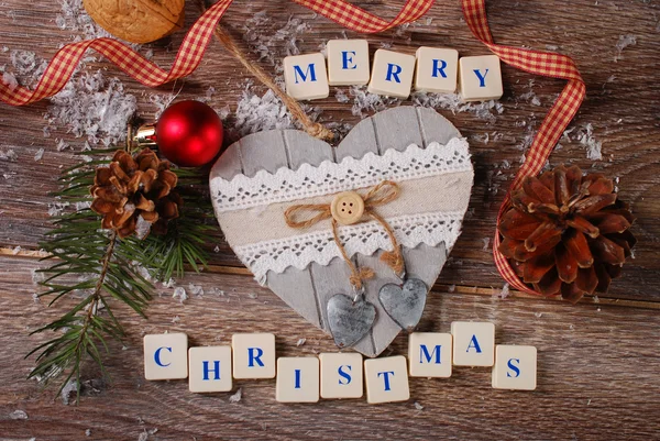 Merry christmas greeting card on wooden background — Stock Photo, Image
