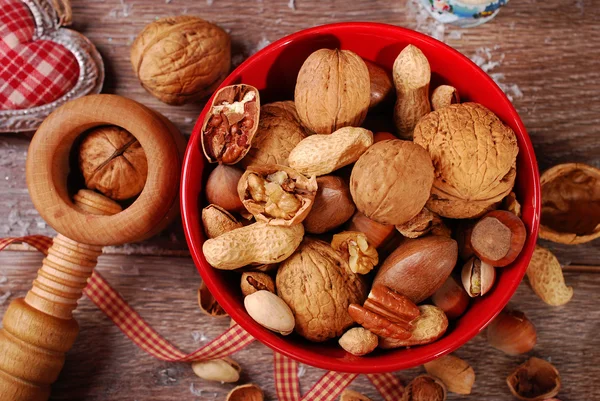 Nuts assortment in bowl on wooden table for christmas — Stock Photo, Image