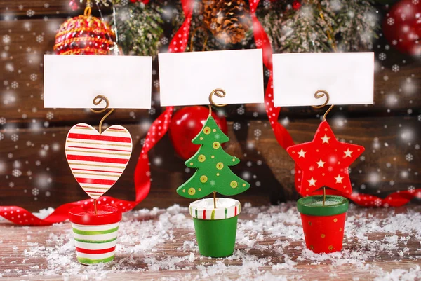 Three christmas greeting card holders on wooden table — Stock Photo, Image