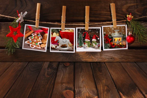 Empty wooden floor and christmas photos hanging on twine — Stock Photo, Image