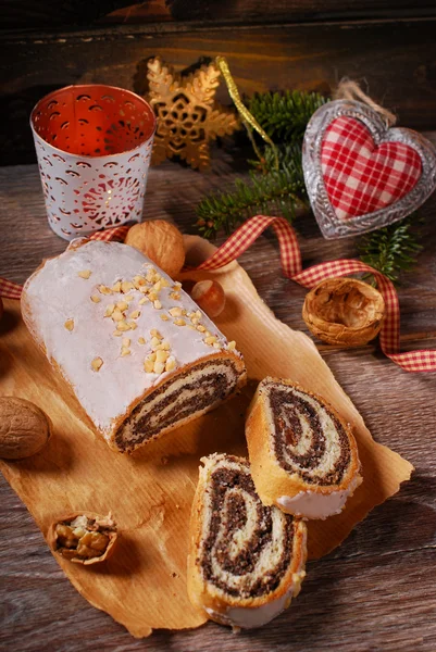 Traditional christmas poppy seed cake on wooden table — Stock Photo, Image