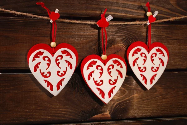 Valentine felt hearts on wooden background — Stock Photo, Image