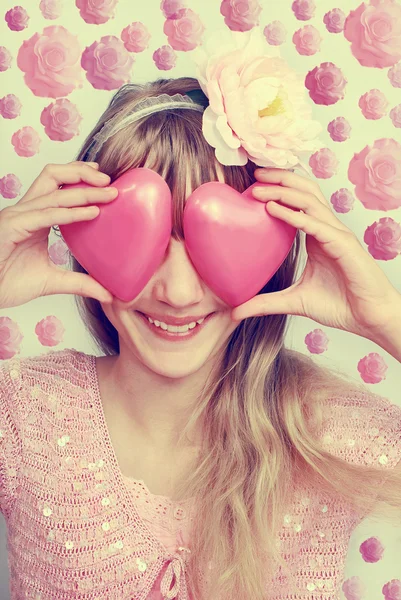 Funny girl holding hearts on eyes-vintage style — Stock Photo, Image