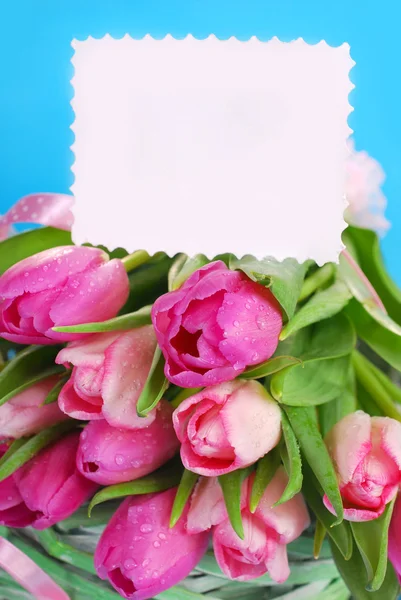 Bunch of pink tulips and blank card — Stock Photo, Image