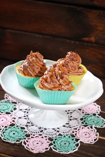 Cupcakes with truffle cream and caramel — Stock Photo, Image