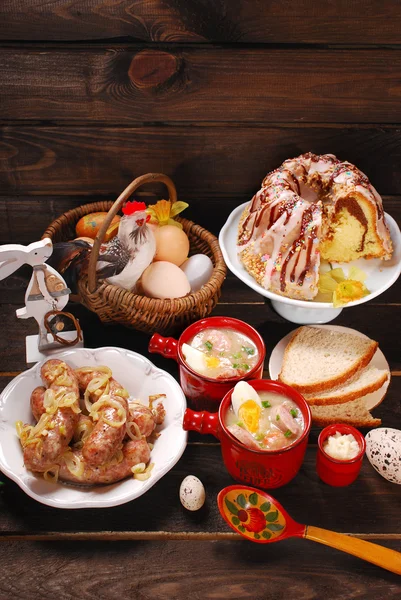 Easter traditional dishes on rural wooden table — Stock Photo, Image