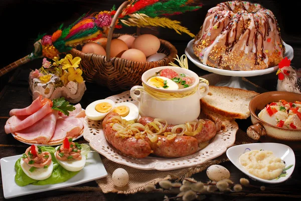 Easter traditional dishes on rural wooden table — Stock Photo, Image