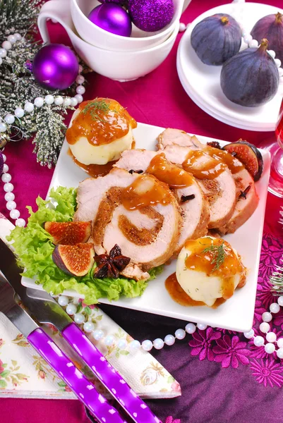 Christmas dinner with loin of pork stuffed with figs and potato — Stock Photo, Image