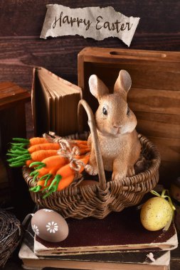 Şirin tavşan heykelciği ve sepetinde keçeli havuç desteleri olan köylü tarzı Paskalya kartı.
