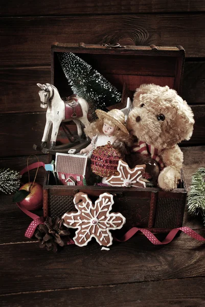 Vintage christmas toys in old treasure chest — Stock Photo, Image