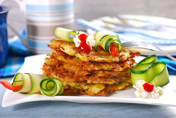 Stack of zucchini and potato pancakes — Stock Photo, Image