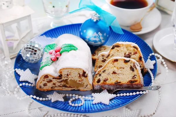 Christmas stollen cake on blue plate — Stock Photo, Image