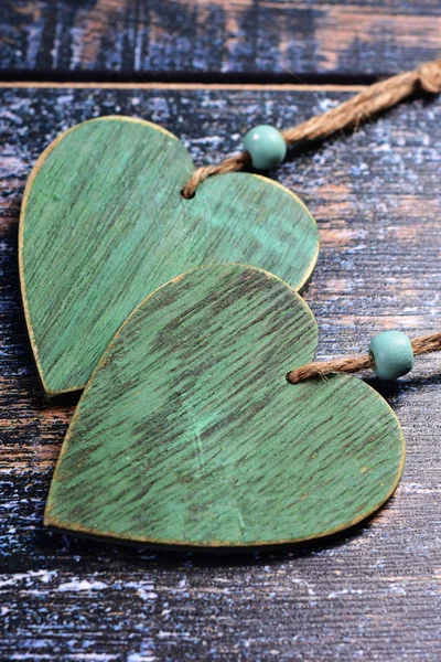 Two wooden hearts on shabby background — Stock Photo, Image