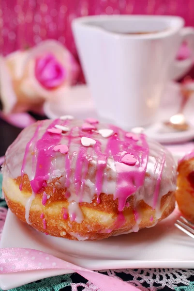 Cherry filled donuts with icing and coffee for valentines — Stock Photo, Image