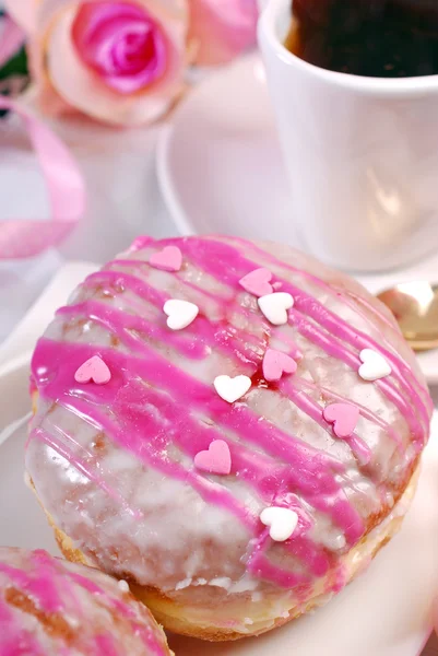 Cherry filled donuts with icing and coffee for valentines — Stock Photo, Image