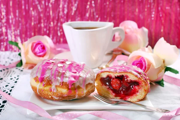Cherry filled donuts with icing and coffee for valentines — Stock Photo, Image