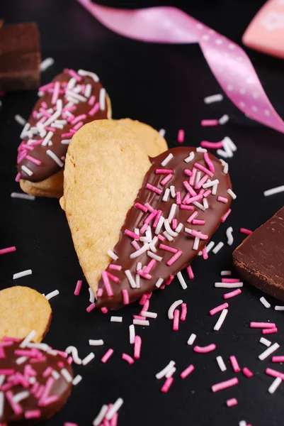 Heart shaped cookies with chocolate and sprinkles — Stock Photo, Image