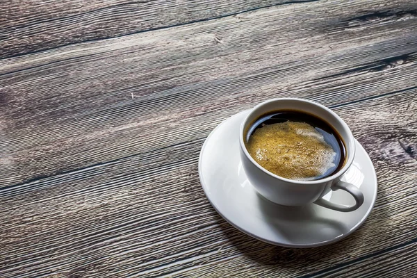 Coffee cup top view on wooden table background — Stock Photo, Image