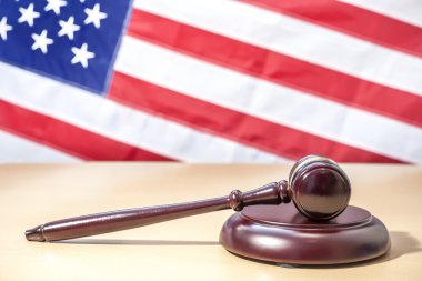 Gavel on a background of the American flag clipart