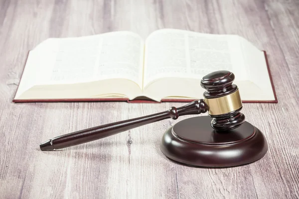 Wooden judge gavel and  book on wooden table — Stock Photo, Image